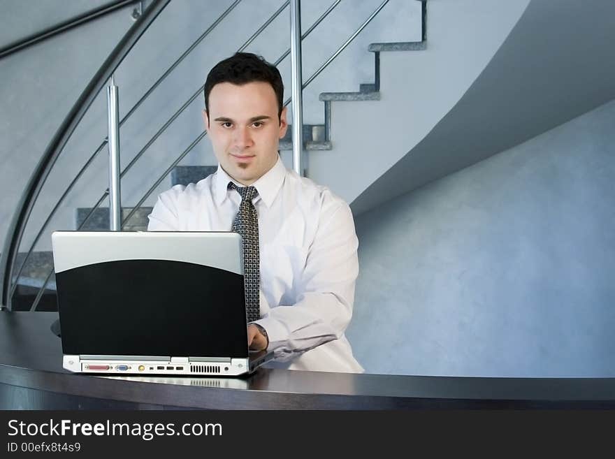 Successful businessman working on laptop