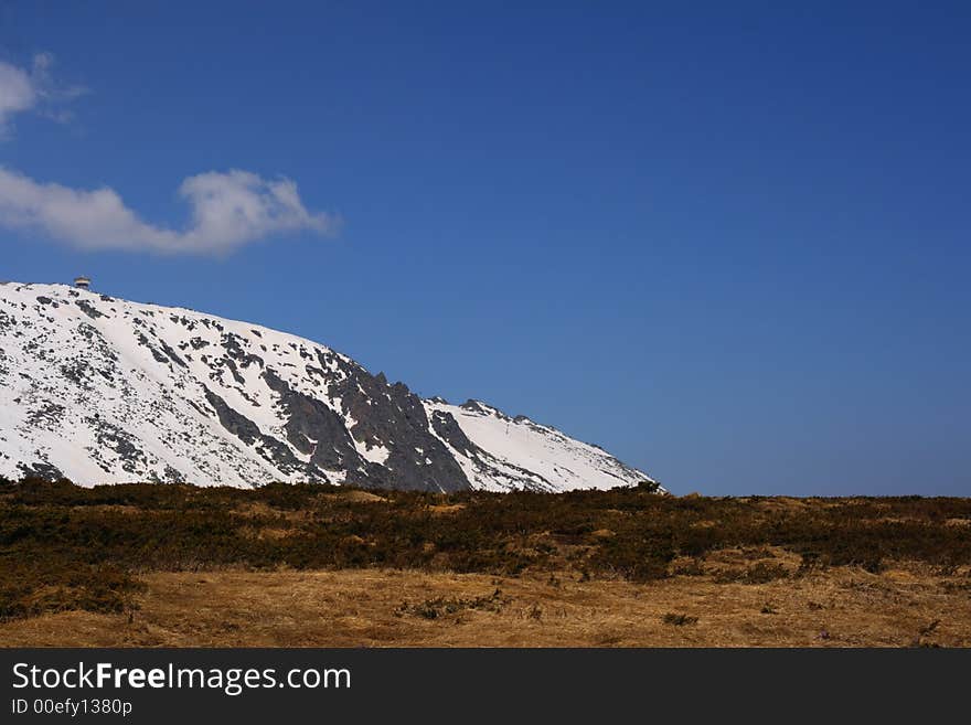 Snowy ridge and a blue sky