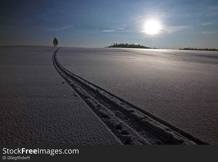 Sun and snow landscape with trail of ski. Sun and snow landscape with trail of ski