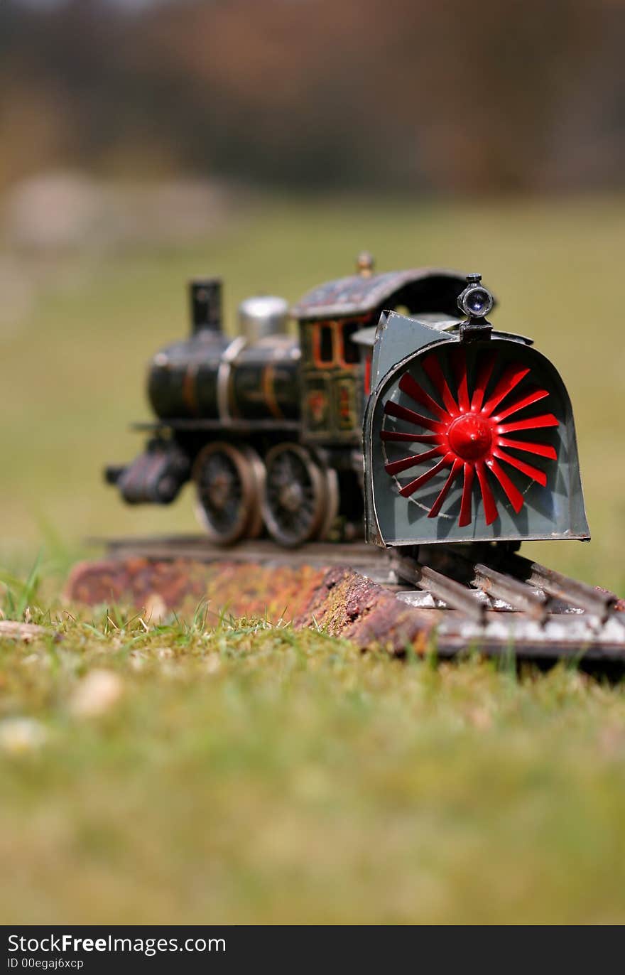 Historic toy train on grass