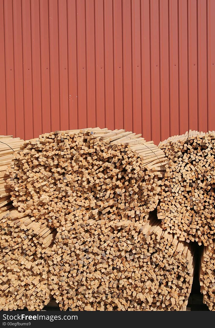 A pile of wooden sticks against blue sky. A pile of wooden sticks against blue sky