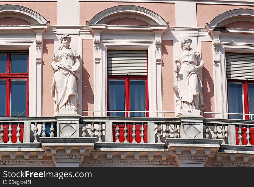 Balcony with standing statue