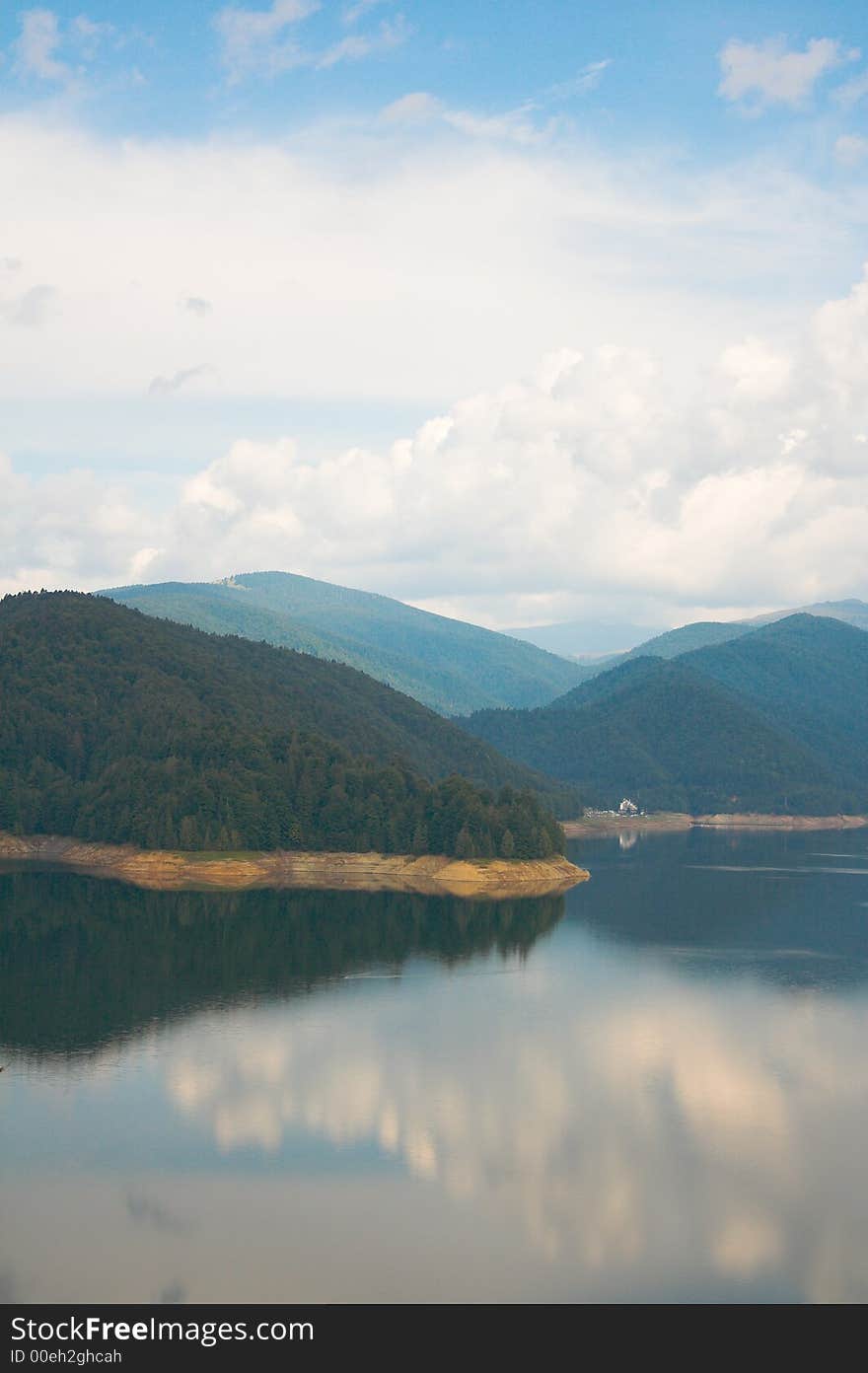 Lake, mountains and clouds on a summer morning. Lake, mountains and clouds on a summer morning