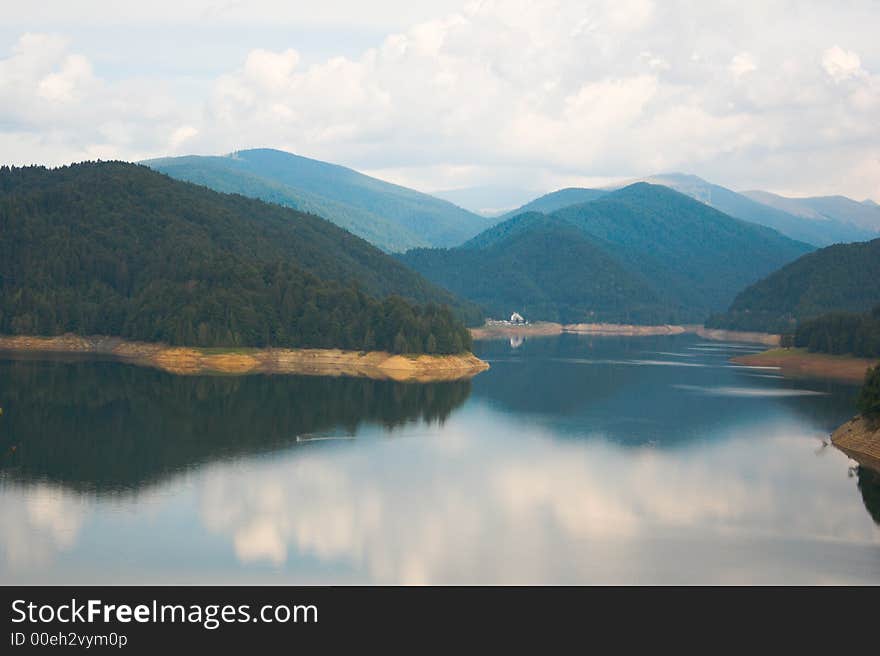 Lake, mountains and clouds on a summer morning. Lake, mountains and clouds on a summer morning