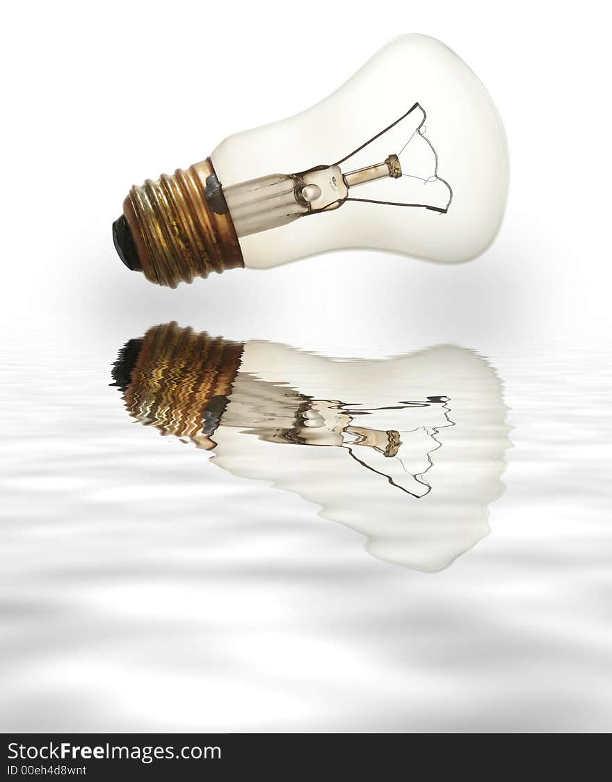 Old light bulb isolated on white with reflection