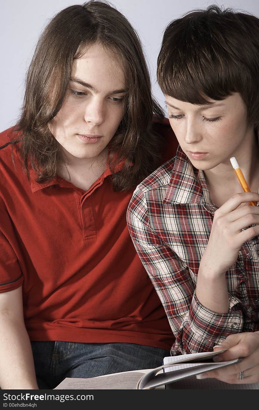 Boy and girl studying together. Boy and girl studying together