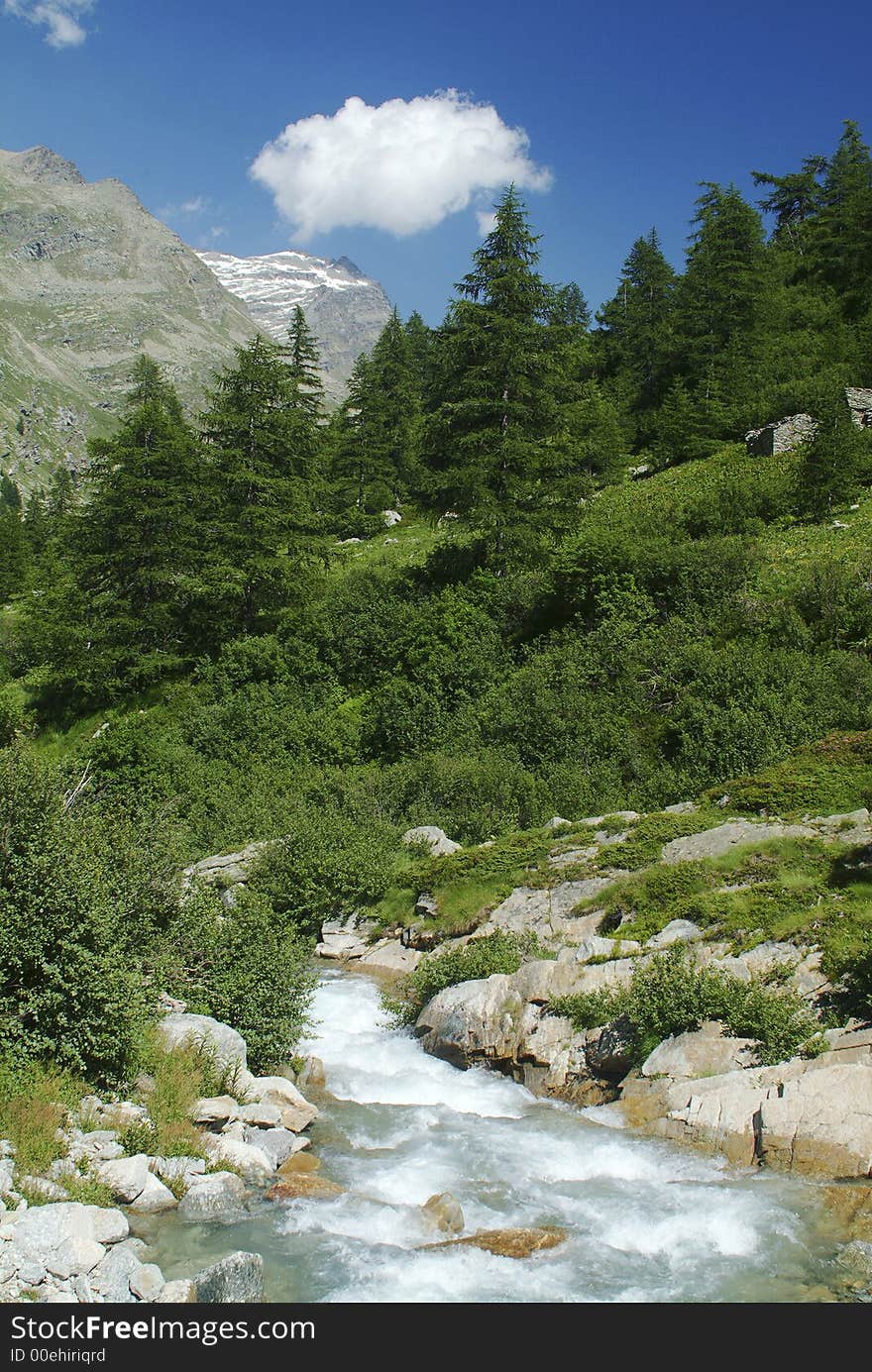 A river cross the valley in the Gran Paradiso National Park, near Ceresole reale, Italy. A river cross the valley in the Gran Paradiso National Park, near Ceresole reale, Italy