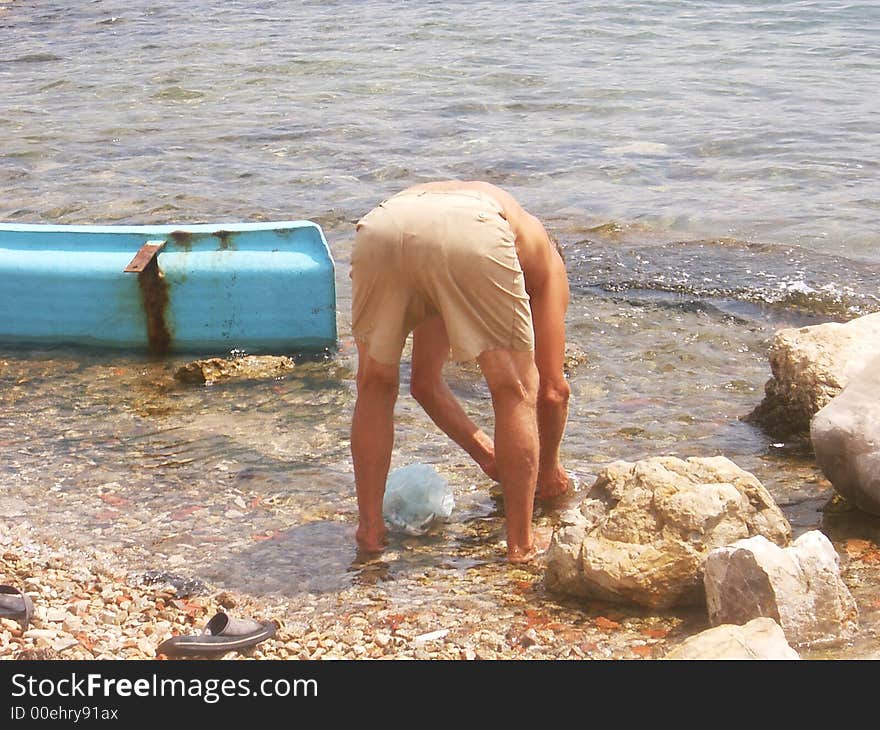 Paparazzo picture of funny old guy in the water. Paparazzo picture of funny old guy in the water.