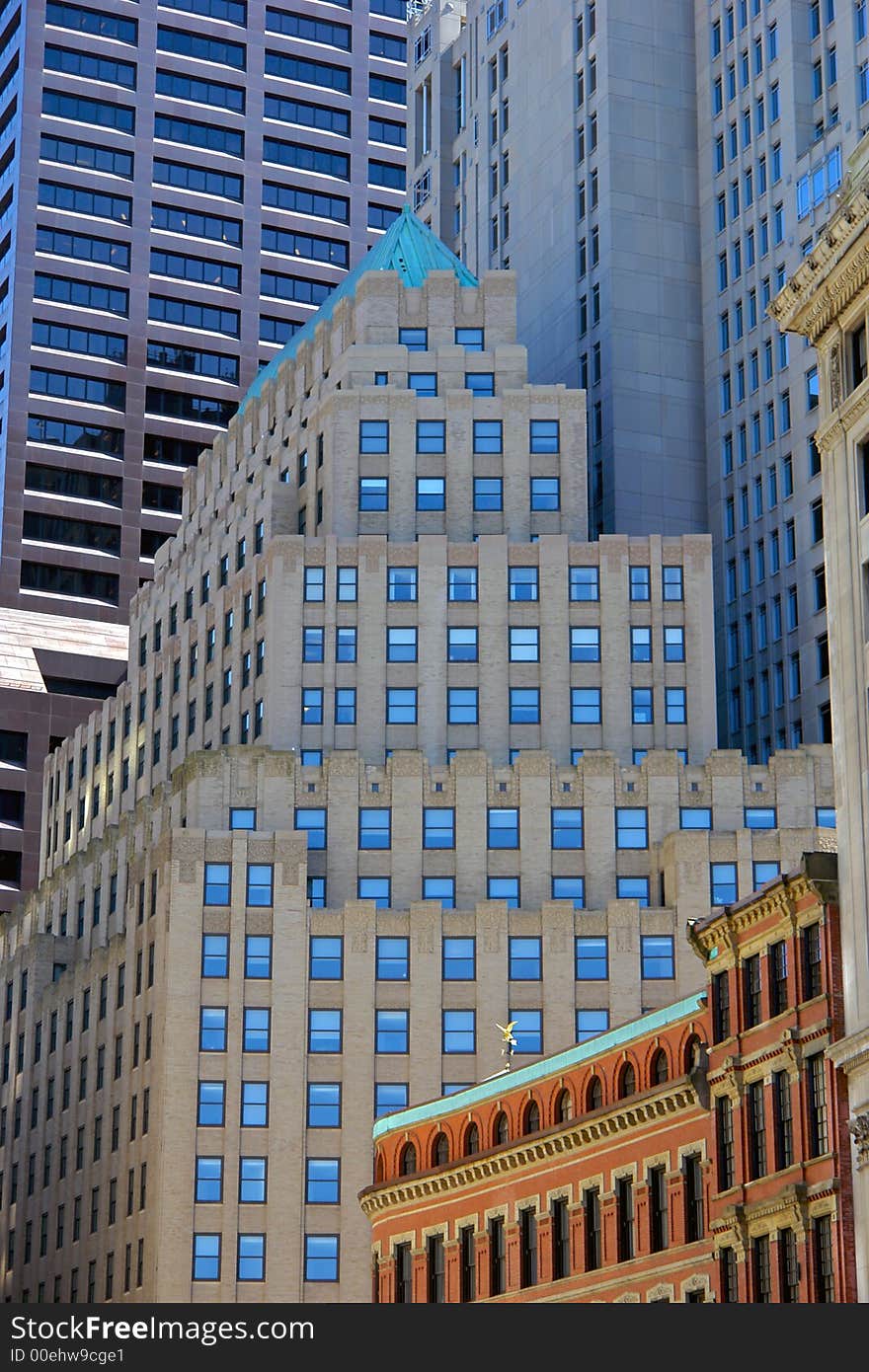 New buildings towering over the old in boston's downtown district. New buildings towering over the old in boston's downtown district