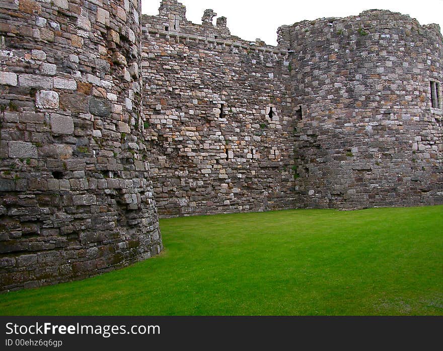 View of one of the great castles in Wales - this one highlights the detailed stone wall. View of one of the great castles in Wales - this one highlights the detailed stone wall