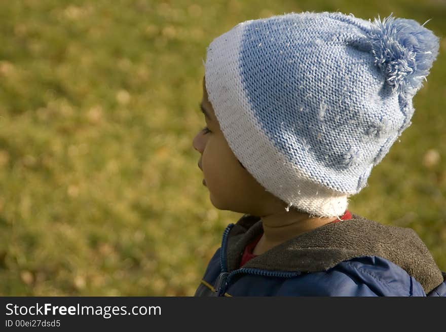 A child pre occupied and distracted with an event. A child pre occupied and distracted with an event