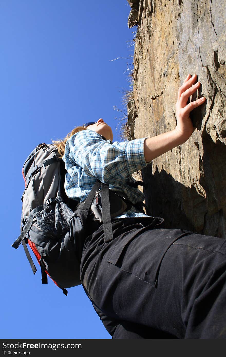 Sportsman climbing on a rock