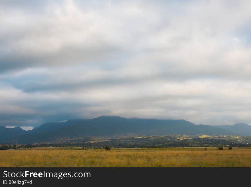 Autumn colors, mountain landscape in a cloudy day