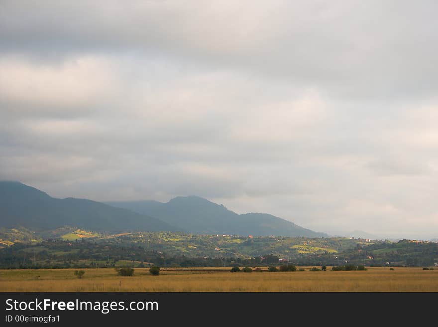 Autumn colors, mountain landscape in a cloudy day