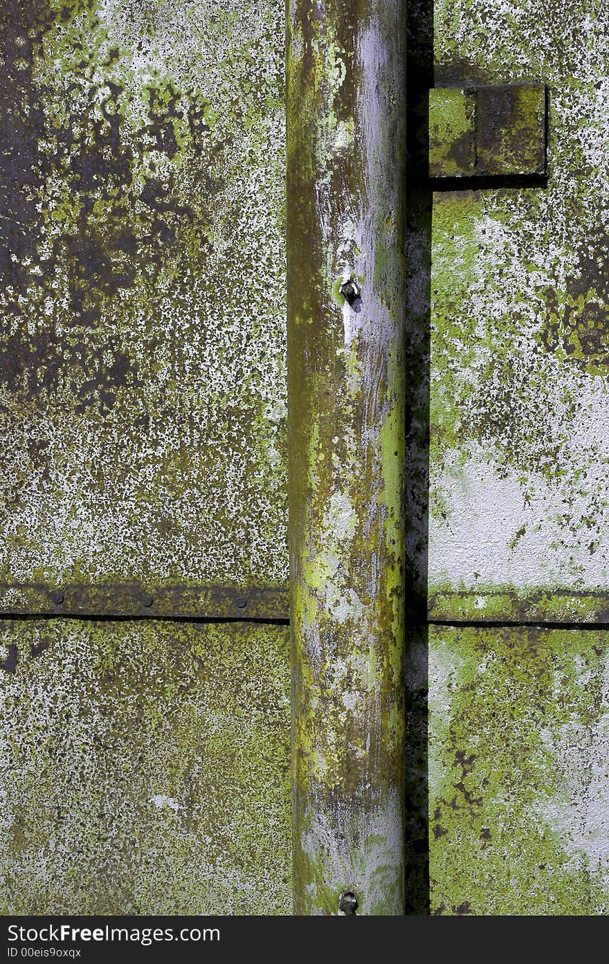Detailed closeup of colorful rusty sheet of old metal with rivets. Detailed closeup of colorful rusty sheet of old metal with rivets