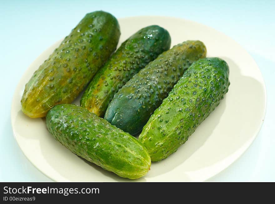 Cucumbers on white cook-table