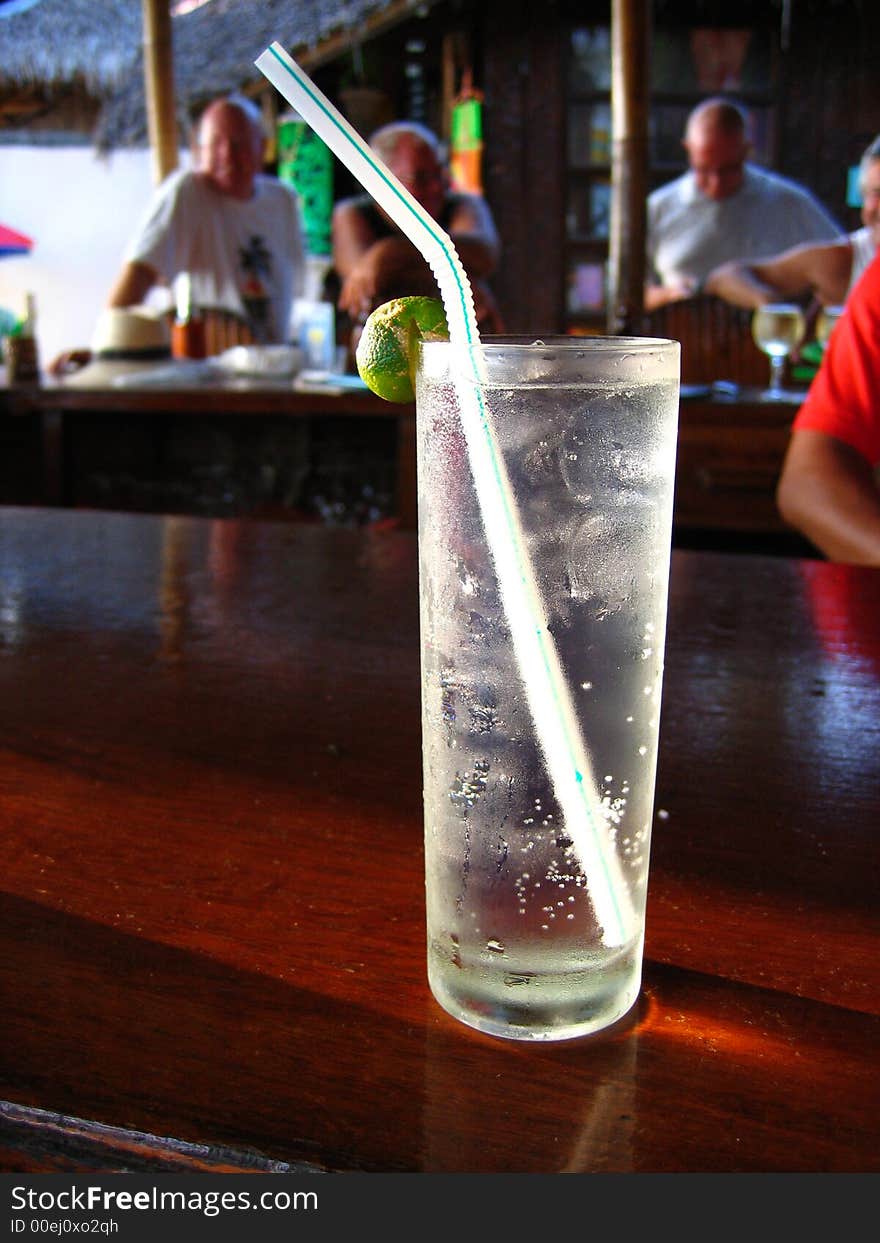 Gin and tonic in paradise with happy hour afternoon crowd. Gin and tonic in paradise with happy hour afternoon crowd