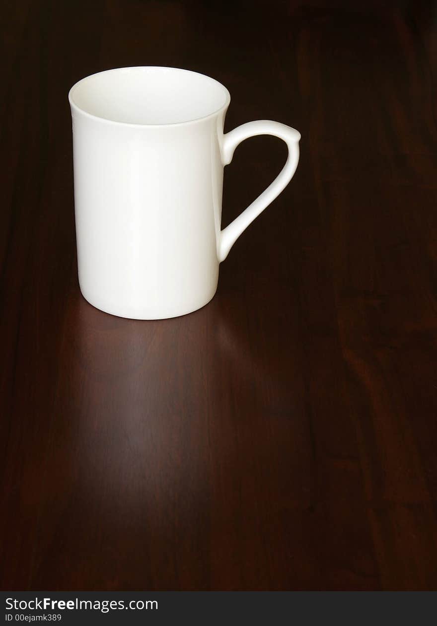 White Empty Coffee Cup On A Dark Wooden Table, Reflection. White Empty Coffee Cup On A Dark Wooden Table, Reflection