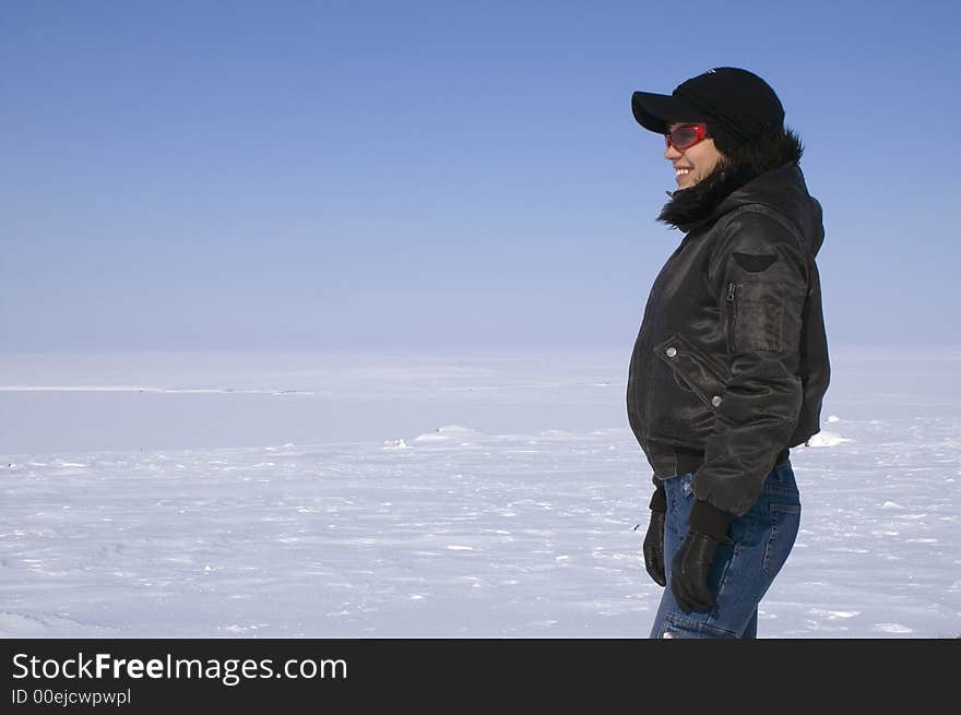 The young woman on a background of snow open space. The young woman on a background of snow open space