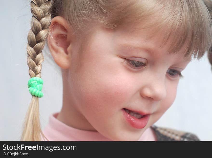 A girl with her hair plaited. A girl with her hair plaited