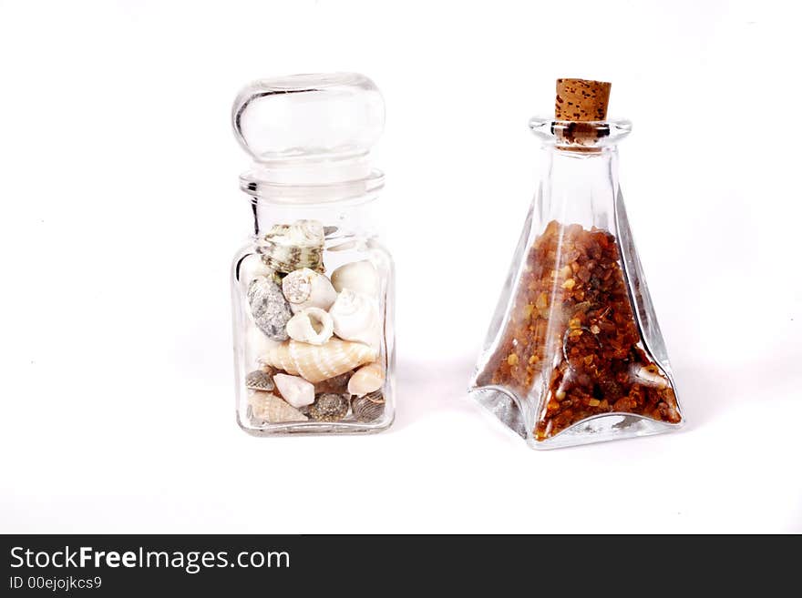 Amber and shells on white background