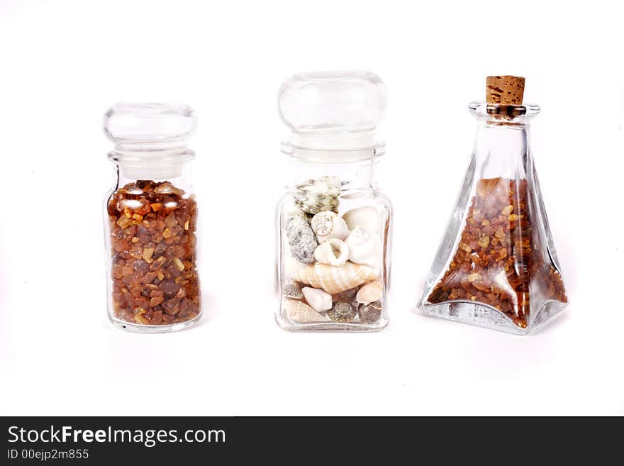 Amber and shells on white background