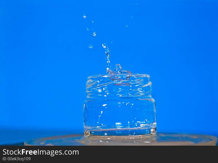 Water jug with splashes water. Water jug with splashes water