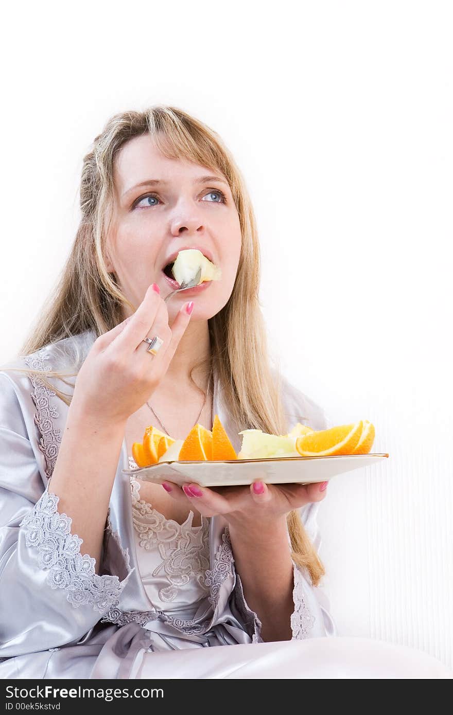 A woman eating melon