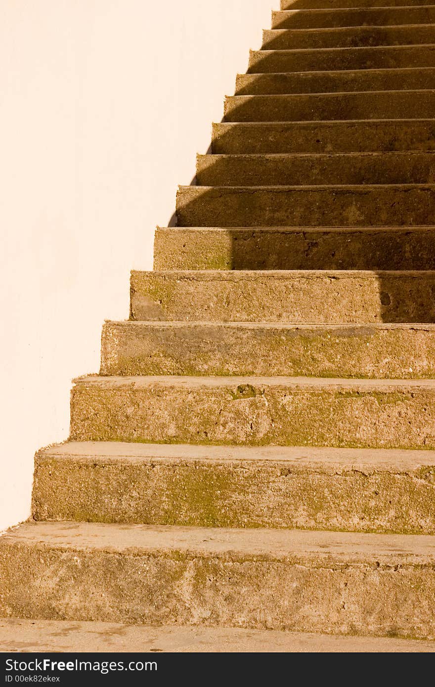 A sand stone staircase in shadow