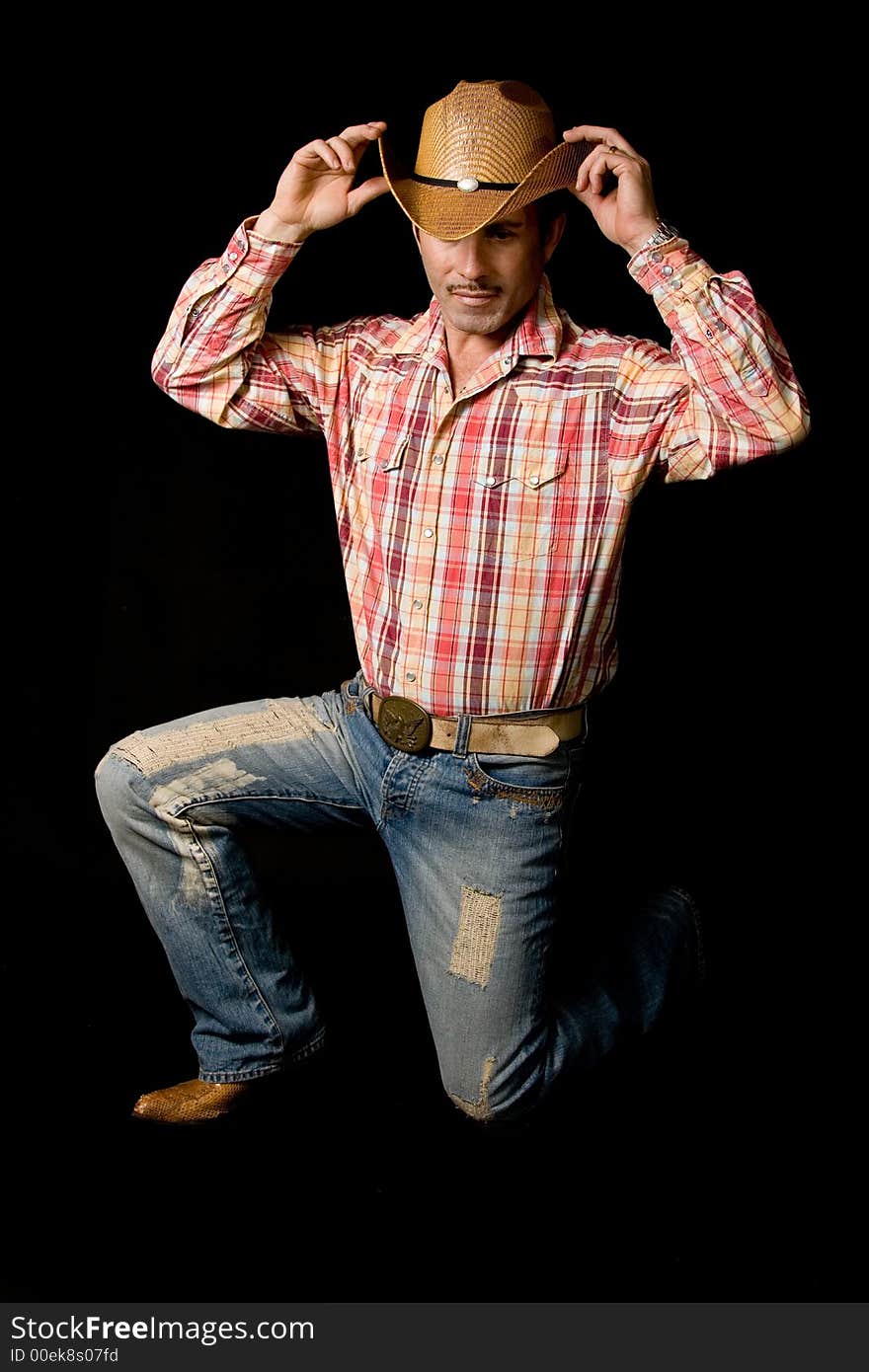 Adult cow boy looking great and posing for fashion shots. Adult cow boy looking great and posing for fashion shots