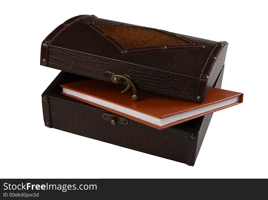 Wooden chest and diary on white background