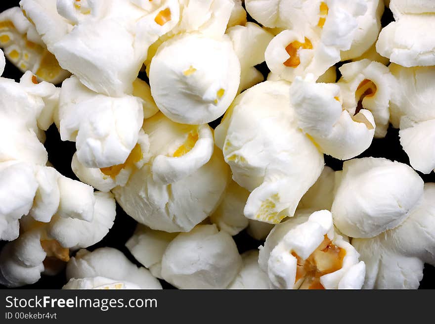 Close-up of pop corn, black background. Close-up of pop corn, black background