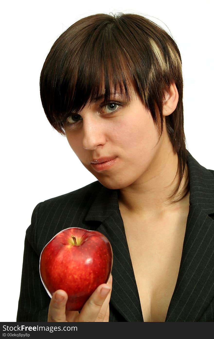 The young businesswomen with a red apple, isolated on white. The young businesswomen with a red apple, isolated on white