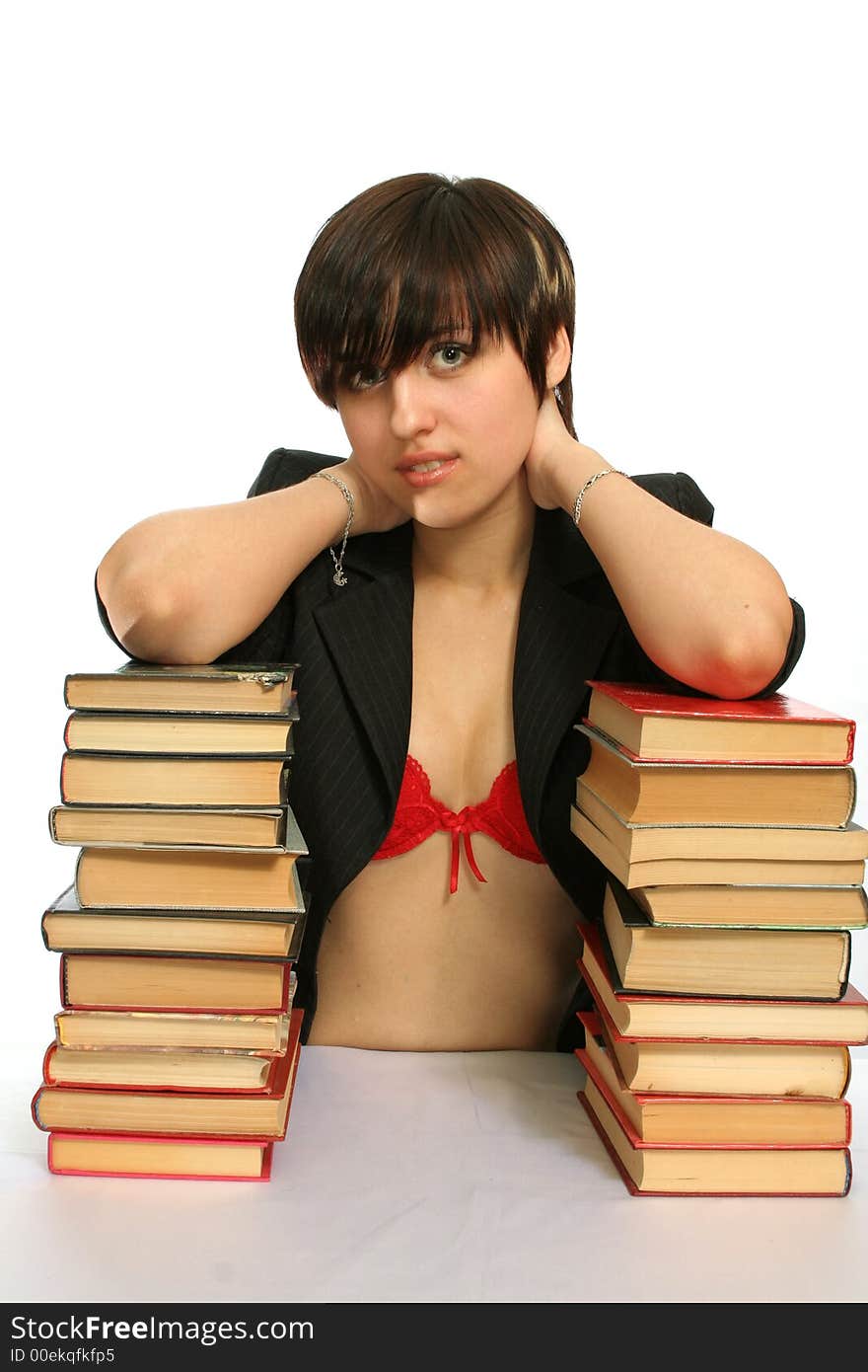 The young smiling girl with books, isolated on white. The young smiling girl with books, isolated on white