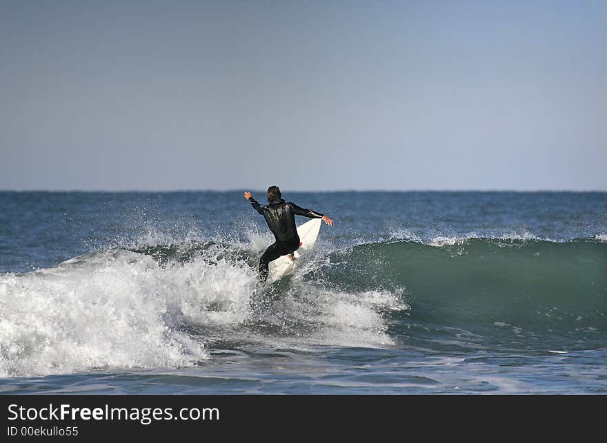 Surfer On Top Of The Wave