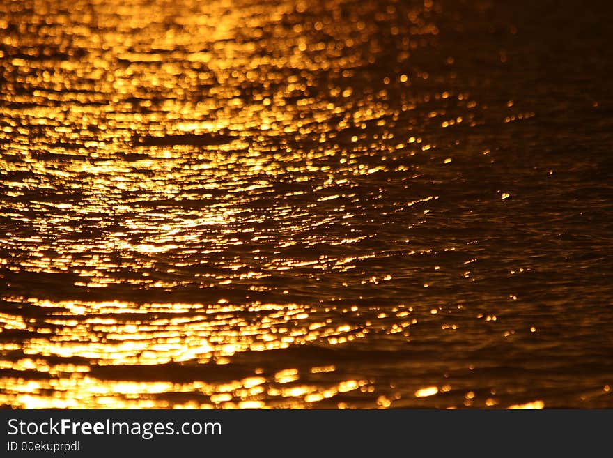 Bright reflection of the sunset on the water