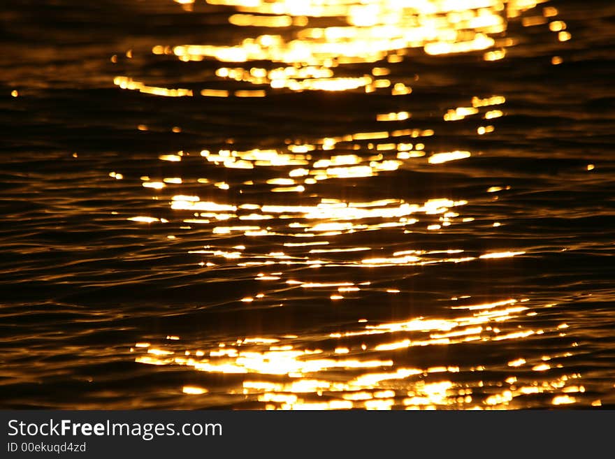 Bright reflection of the sunset on the water