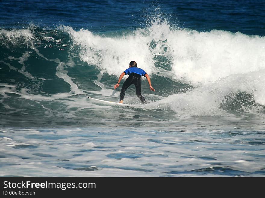 Surfboard rider on a wave. Surfboard rider on a wave