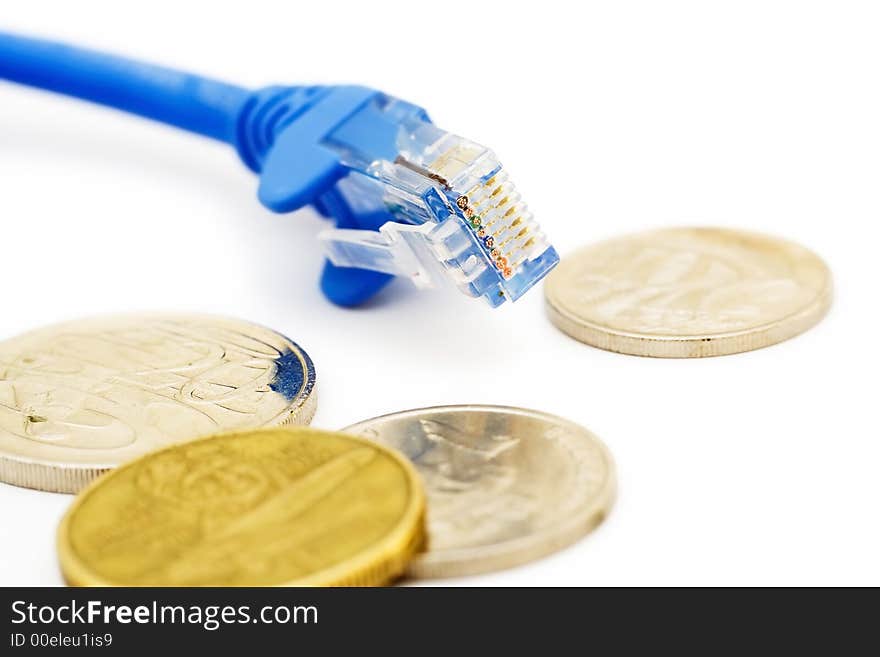 A close-up shot of a lan cable and coins. A close-up shot of a lan cable and coins