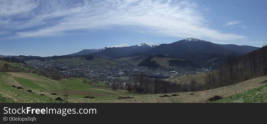 Wide panoramic picture of town in the mountains. Wide panoramic picture of town in the mountains