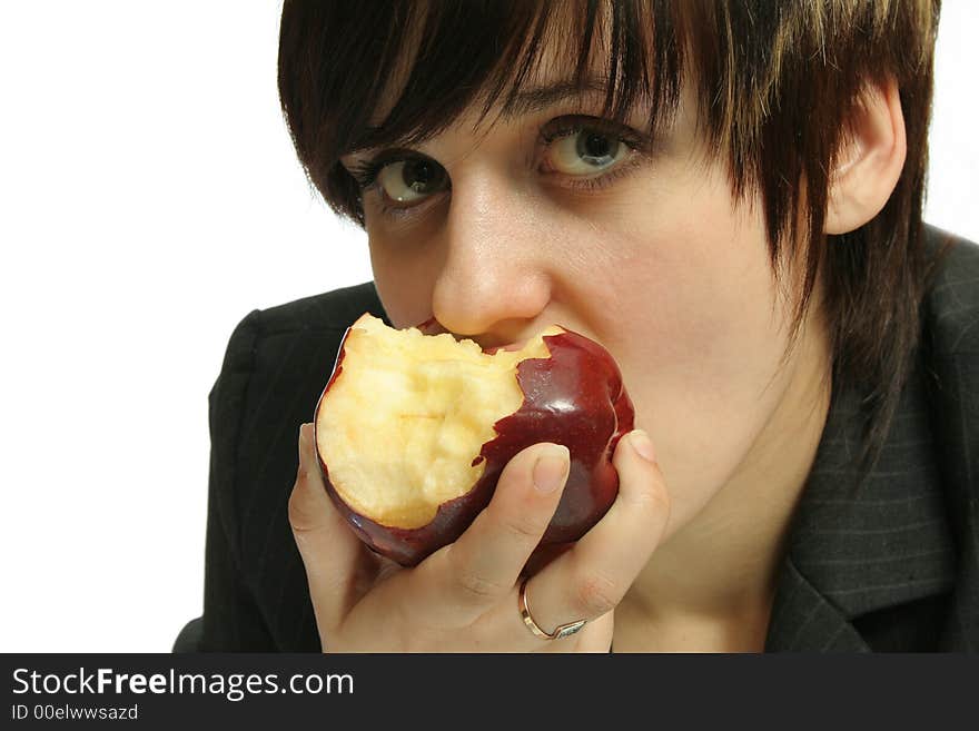 The young nice girl with a red apple, isolated on white. The young nice girl with a red apple, isolated on white