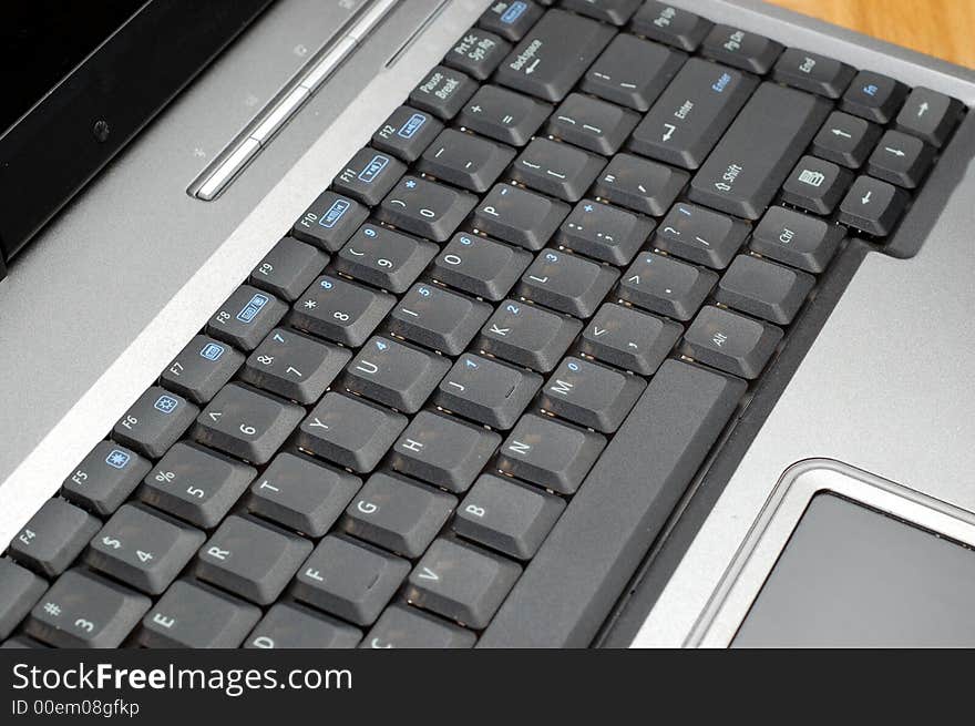 Silver laptop with black keyboard. Silver laptop with black keyboard