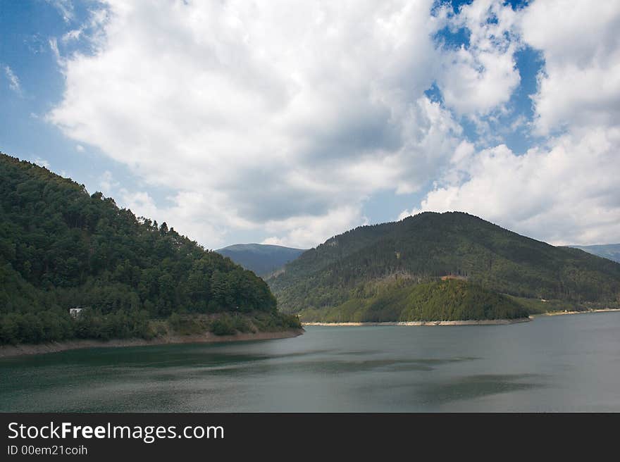 Lake and mountains in a summer day. Lake and mountains in a summer day