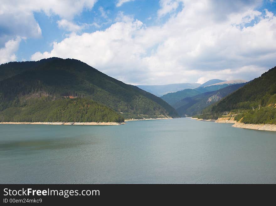 Lake and mountains in a summer day. Lake and mountains in a summer day