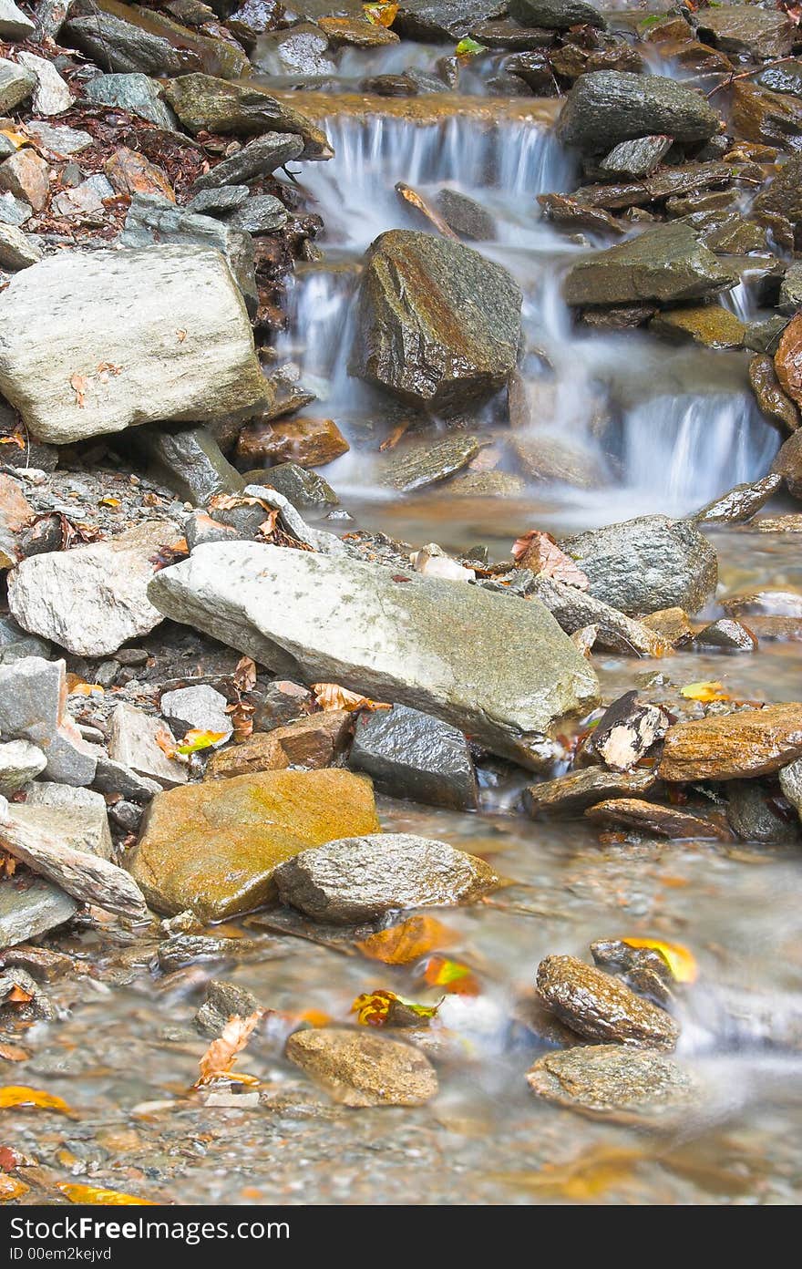 Mountain cold creek flowing fast. Mountain cold creek flowing fast