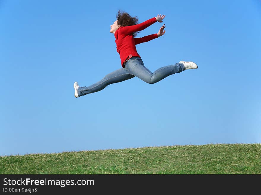 Jump girl on a background of the blue sky. Jump girl on a background of the blue sky