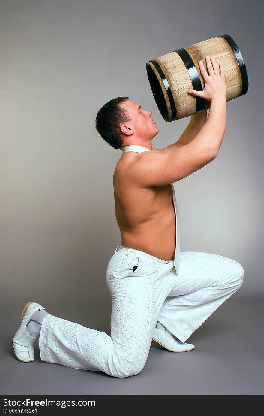 The man drinks from flanks on a grey background. The man drinks from flanks on a grey background