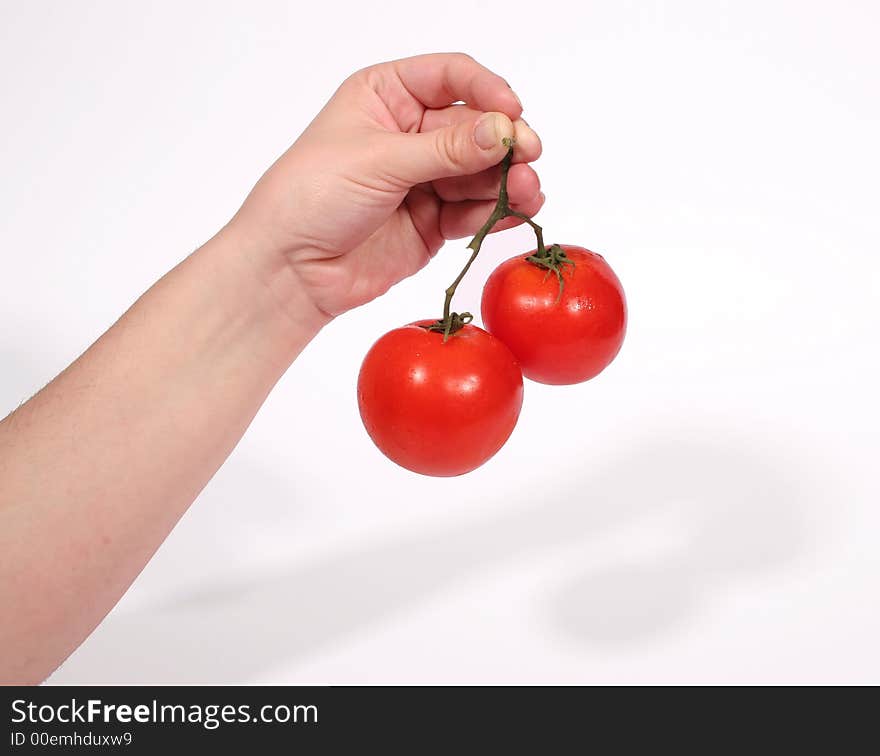 Hand Holding Tomatoes