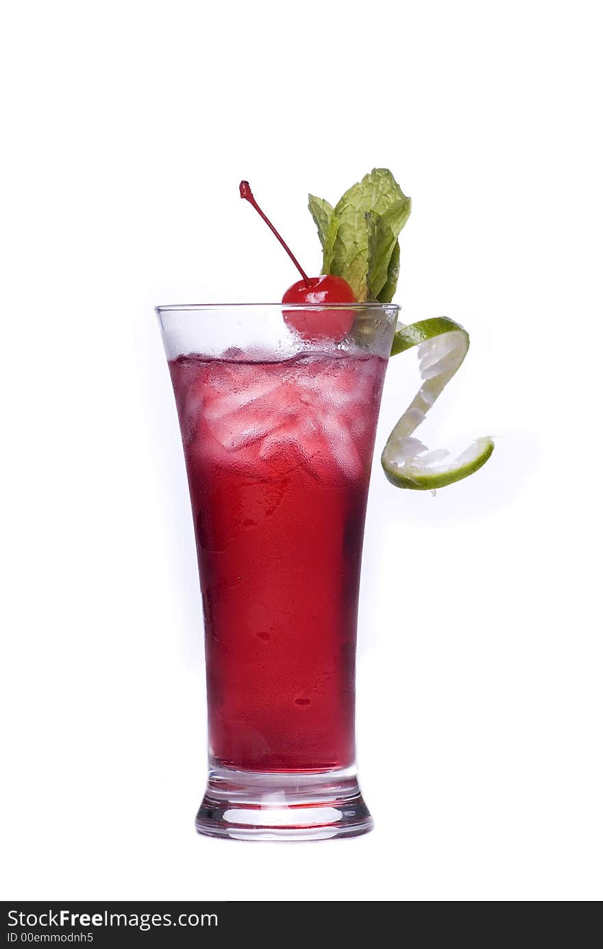 Colorful alcoholic cocktail in a tall glass against white background. Colorful alcoholic cocktail in a tall glass against white background