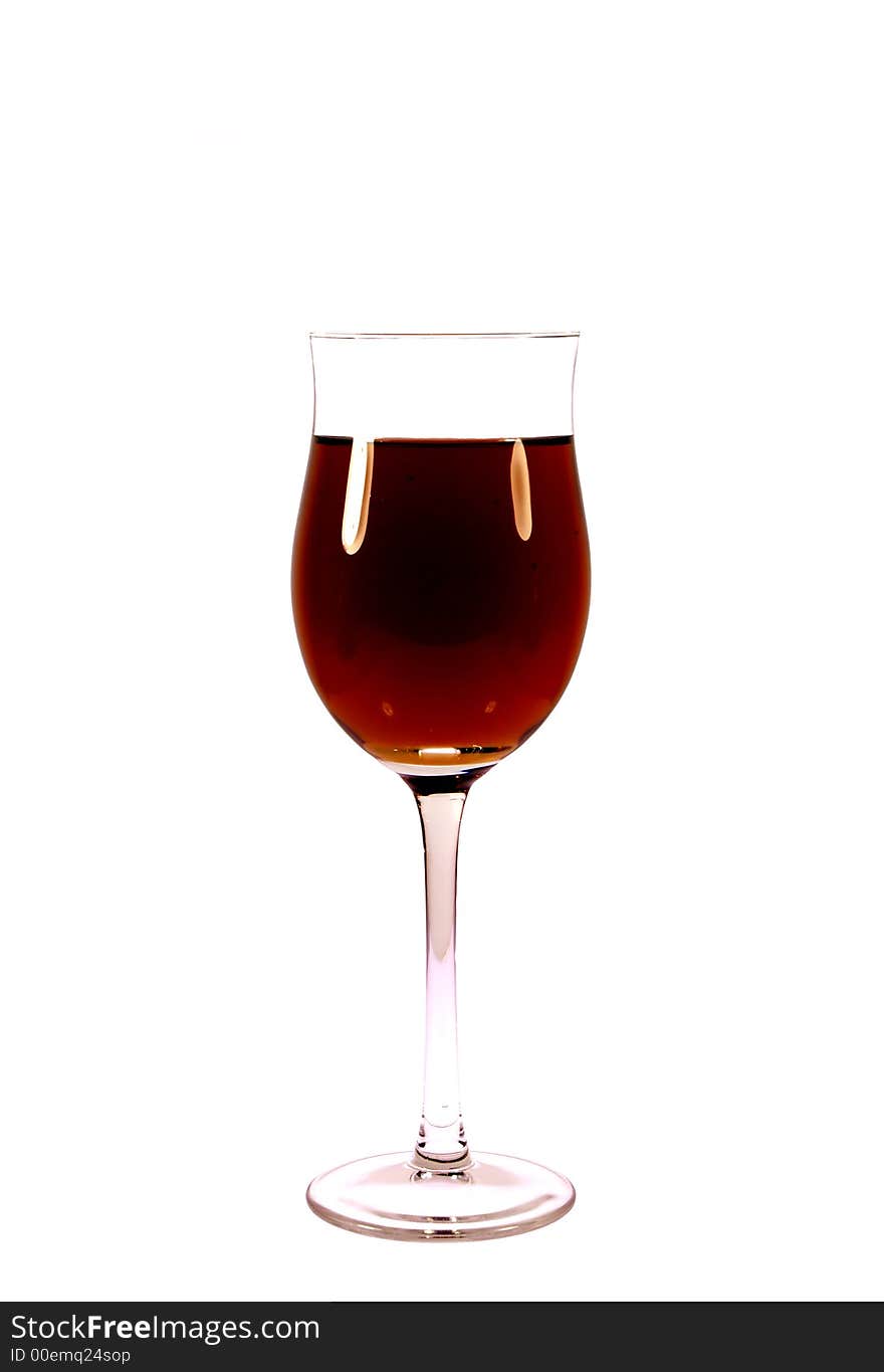 Red wine in glass on the white background